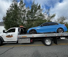 Blue BMW strapped on a SafeTow flatbed